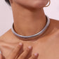 Silver Statement Choker Necklace worn by model, showcasing its elegant design and shiny rhodium finish.